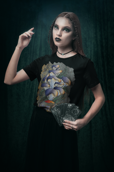 Woman wearing a black t-shirt with mystic coloured mushrooms