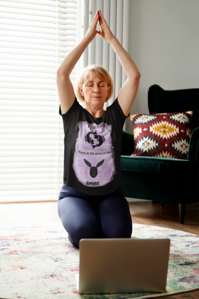 Woman sitting on floor doing yoga